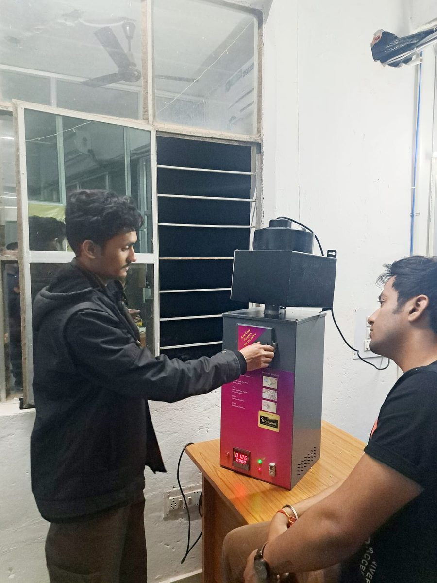 Techlance sanitary napkin incinerator being demonstrated, with the temperature display lit